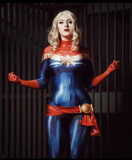Cosplayer dressed as Captain Marvel in a red, blue, and gold costume