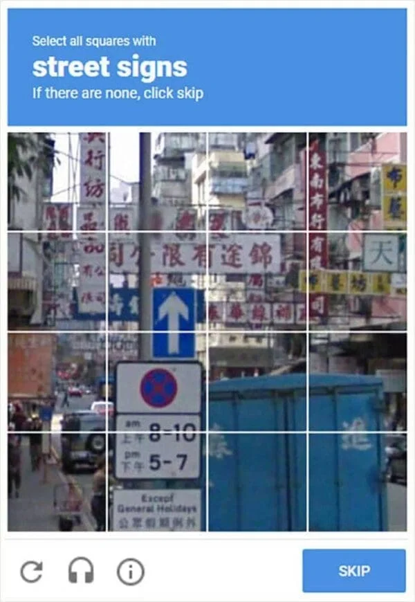 Captcha Difficulty — A reCAPTCHA challenge asking users to select street signs from urban street photography.