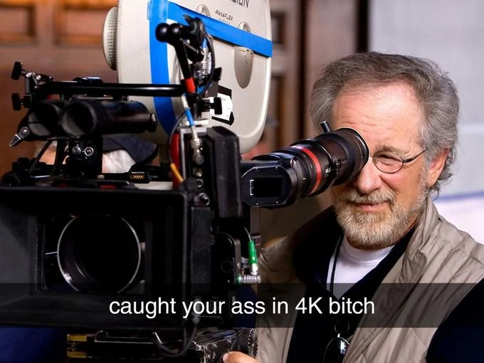 Steven Spielberg with cinema camera and "caught in 4K" text overlay