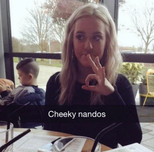Snapchat of a blonde girl doing an OK gesture captioned 'Cheeky nandos'
