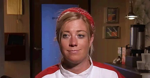 Chef's Kiss — Woman in indoor setting, unclear gesture
