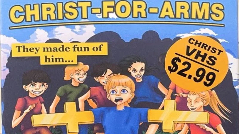 Christ For Arms — Official Christ-For-Arms VHS cover with cartoon crucifix-armed boy and $2.99 badge.