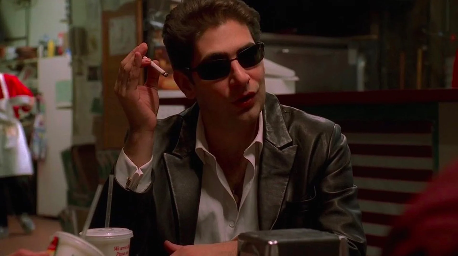 Christopher Moltisanti Explains — Christopher Moltisanti in sunglasses holding a cigarette at a diner table in The Sopranos