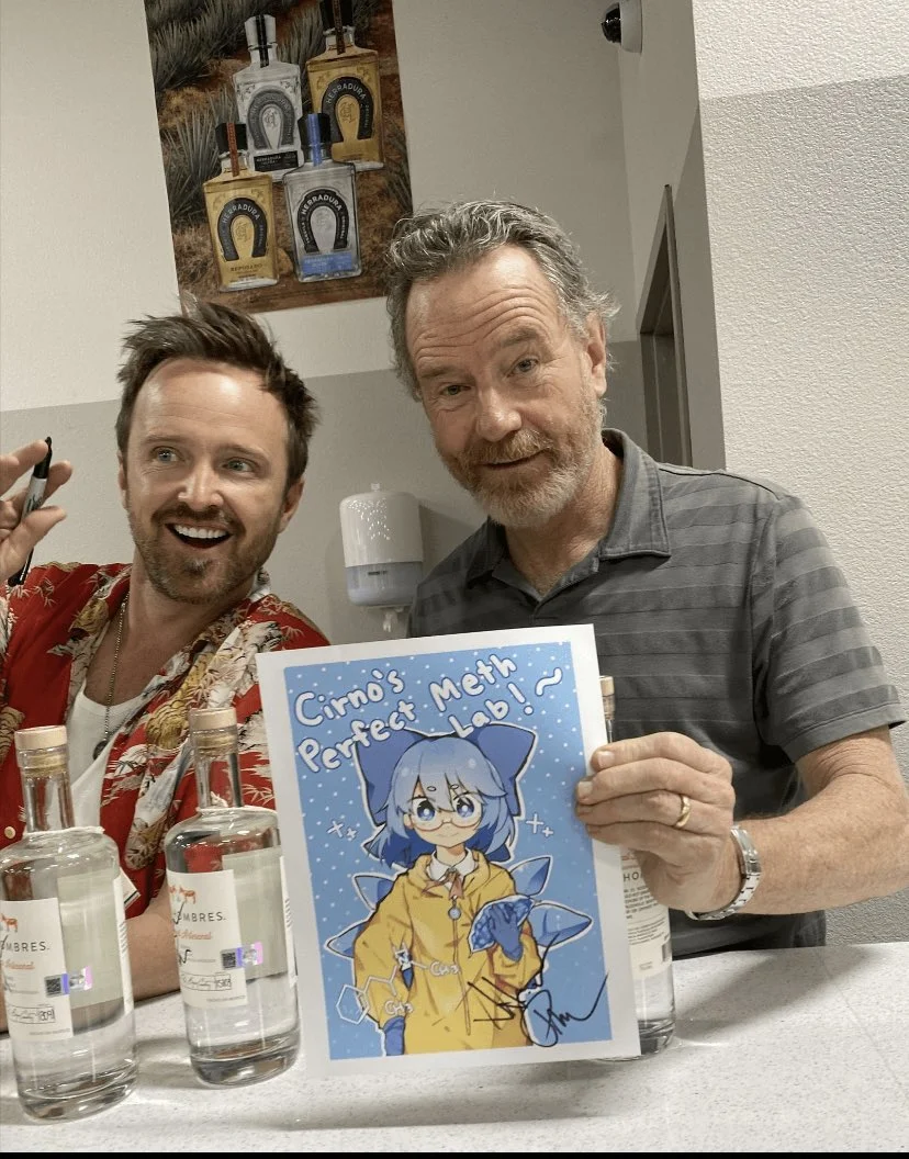 Cirno's Perfect Math Class — Aaron Paul and Bryan Cranston holding a fan drawing titled Cirno's Perfect Meth Lab