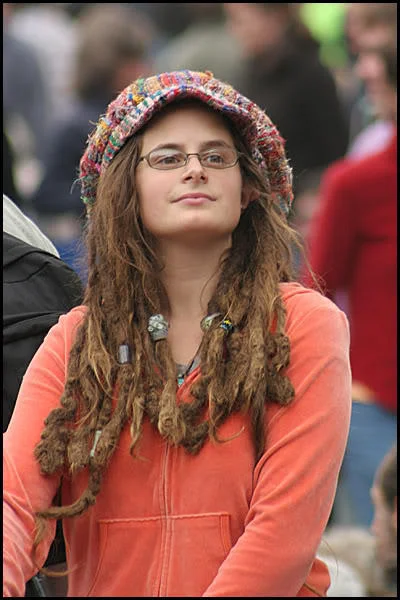 Original photo of woman with dreadlocks and knit hat used for College Liberal meme