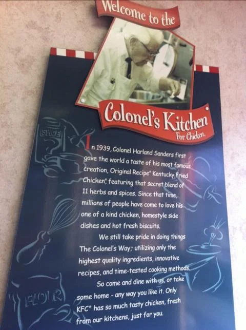 KFC restaurant poster about Colonel's Kitchen with Comic Sans copy.