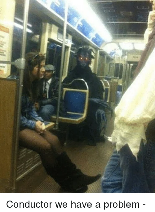 Conductor We Have A Problem! — Subway car photo of a passenger wearing a demonic horned mask with glowing red eyes, captioned 'Conductor we have a problem'.