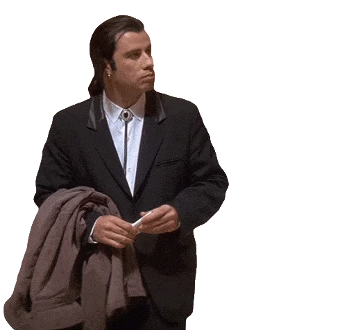 Confused Travolta — John Travolta's cutout in confused pose carrying a jacket against a solid dark red background.
