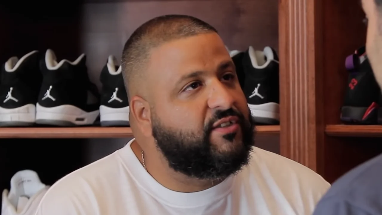 Congratulations You Played Yourself — DJ Khaled speaking in front of a shelf of Air Jordan sneakers