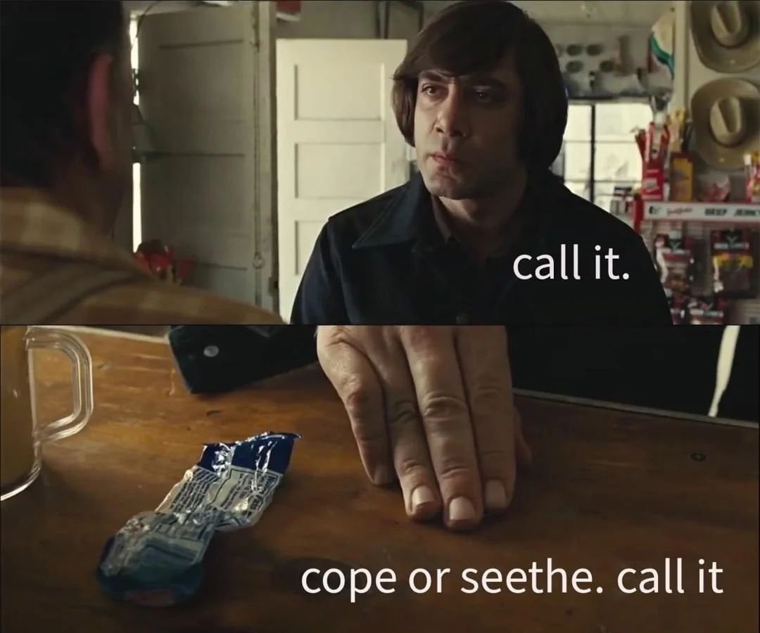 Cope and Seethe — Film scene of a man at a table with overlaid text reading 'call it cope or seethe. call it'.