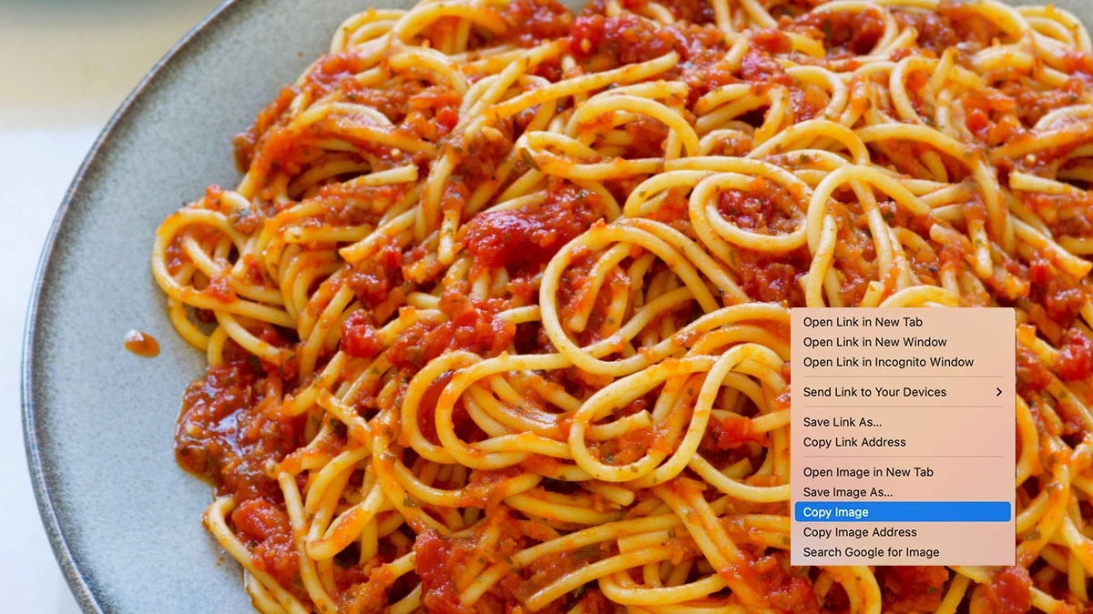 Copypasta — Plate of spaghetti with tomato sauce and a browser right-click menu highlighting 'Copy Image'