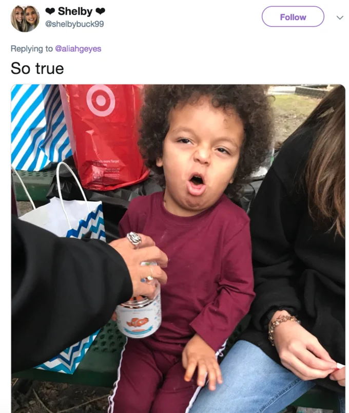Coughing Cat — Tweet with photo of a curly-haired toddler mid-cough with mouth open