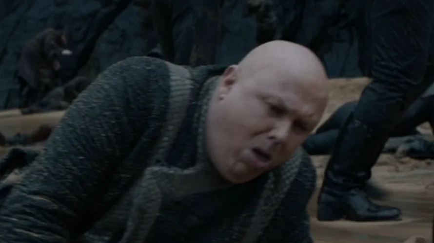 Coughing Varys — Close-up of Varys coughing with mouth open on the battlefield