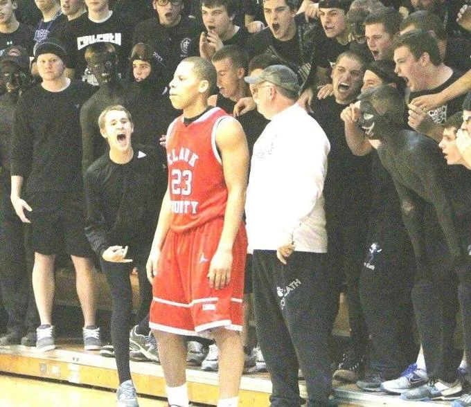Covington High School Students Confrontation With Native American Activists — High school basketball crowd with several students wearing black face paint