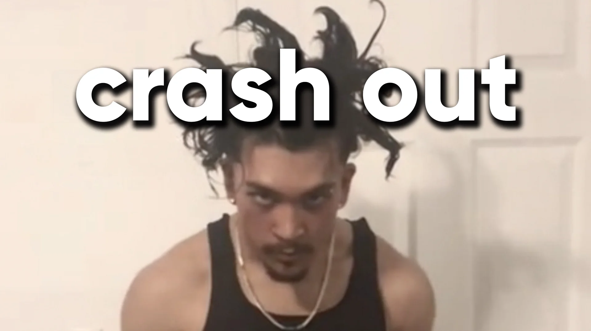 Crashout Crash Out — Young man with wildly flying hair and an intense stare beneath large white 'crash out' text