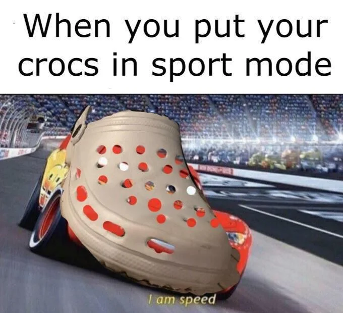 A Croc edited onto Lightning McQueen's body racing on a track, captioned 'When you put your crocs in sport mode / I am speed'.