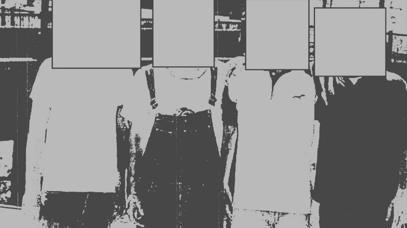 Dancing Israelis — Four figures with faces redacted by gray boxes in a high-contrast FBI photo
