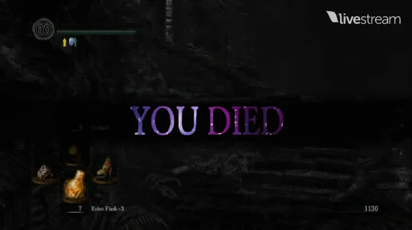 Dark Souls You Died — Livestream capture of 'YOU DIED' game over screen in purple-tinted serif text against dark medieval game environment.