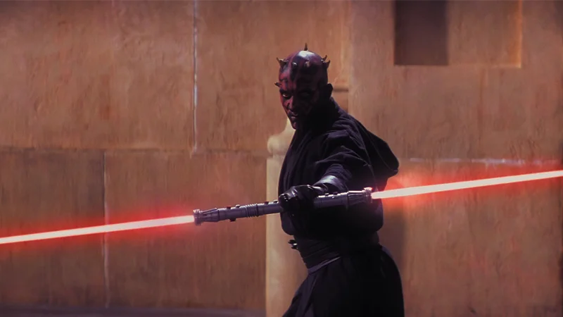 Darth Mauls Double Sided Lightsaber — Darth Maul holding his double-bladed red lightsaber in a fighting stance