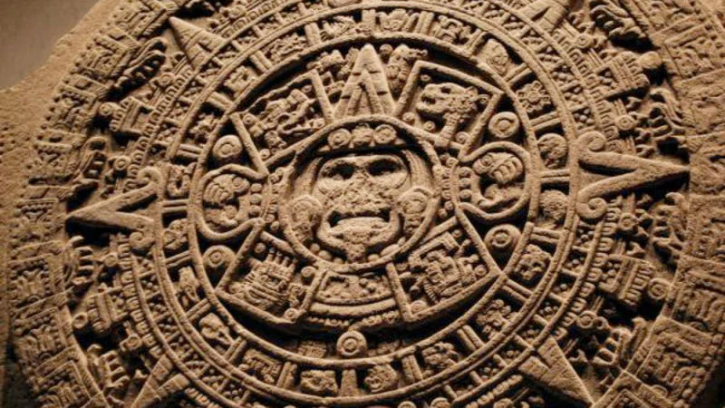 December 21St 2012 — Close-up photograph of Aztec Sun Stone, large carved basalt disc with elaborate circular design, concentric rings, and Aztec symbols.
