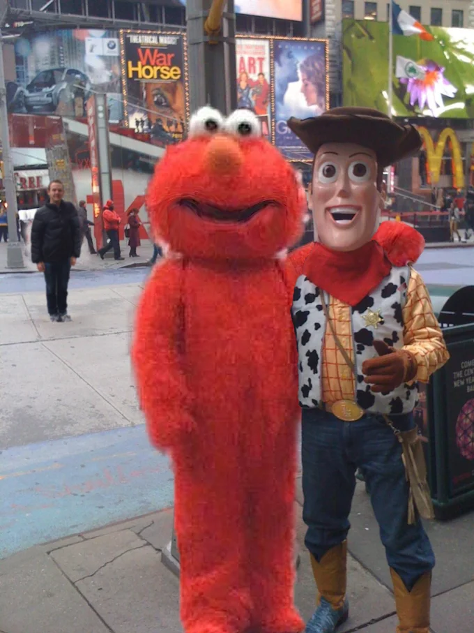 Devastated Elmo — Photoshopped Elmo replacing tourist next to Woody in Times Square