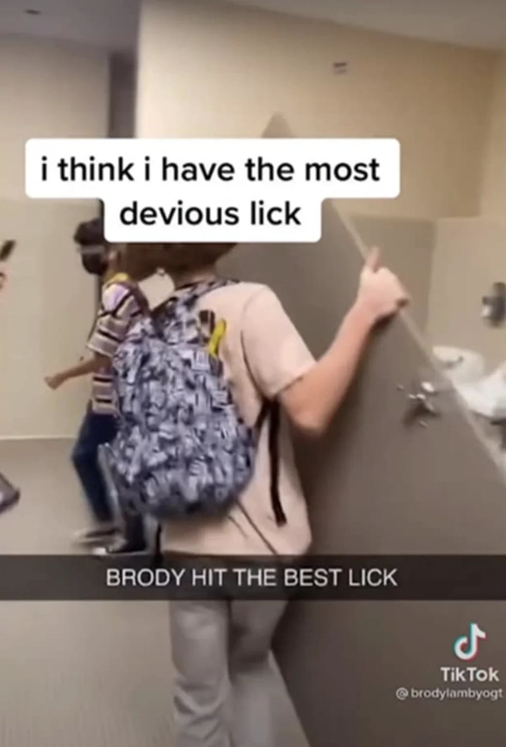TikTok screenshot of student in school bathroom with text 'i think i have the most devious lick' and Snapchat caption 'BRODY HIT THE BEST LICK'.