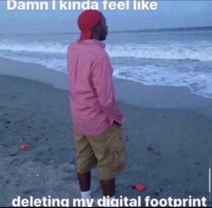 Person on beach feeling urge to delete their digital footprint