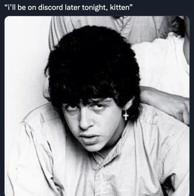 Discord Kitten — Black and white photo of young man with cross earring captioned 'I'll be on discord later tonight kitten'
