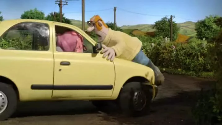Dishub Officer Stuck On The Car Hood — Masked person in safety vest on hood of yellow car in rural setting recreating dishub officer meme.