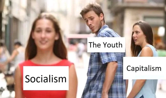 Political Distracted Boyfriend variant labeling woman as 'Socialism', boyfriend as 'The Youth', girlfriend as 'Capitalism'.