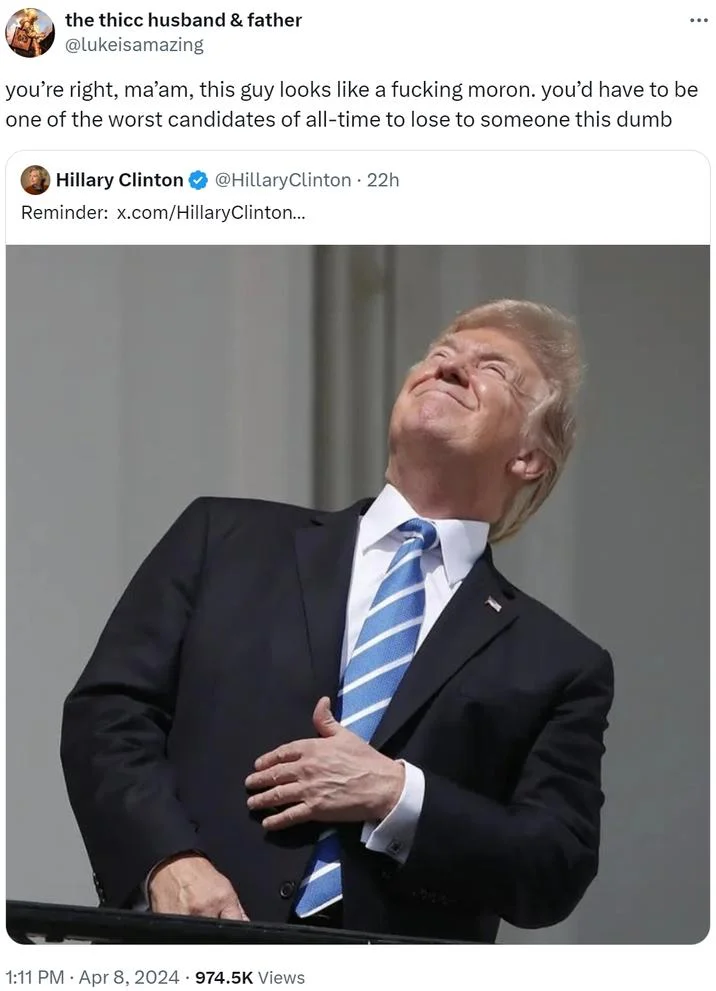 Donald Trump Staring At The Eclipse — Tweet reply mocking Hillary Clinton with the iconic Trump eclipse photo