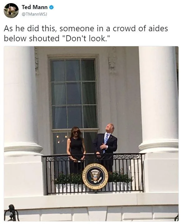 Donald Trump Staring At The Eclipse — Tweet by Ted Mann with photo of Trump and Melania looking up at the eclipse from the White House balcony