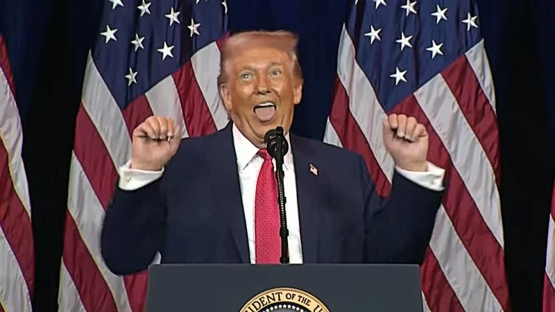 Donald Trump Trans Weightlifter Impression Ahegao Face — Trump at podium making a distinctive exaggerated facial expression with raised clenched fists against