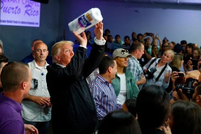 Donald Trumps Paper Towel Toss — Trump lofting a roll of paper towels toward a crowd in Puerto Rico