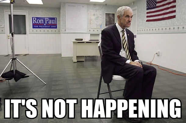 Doom Paul Its Happening — Ron Paul sitting alone in an empty campaign office with caption 'It's not happening'