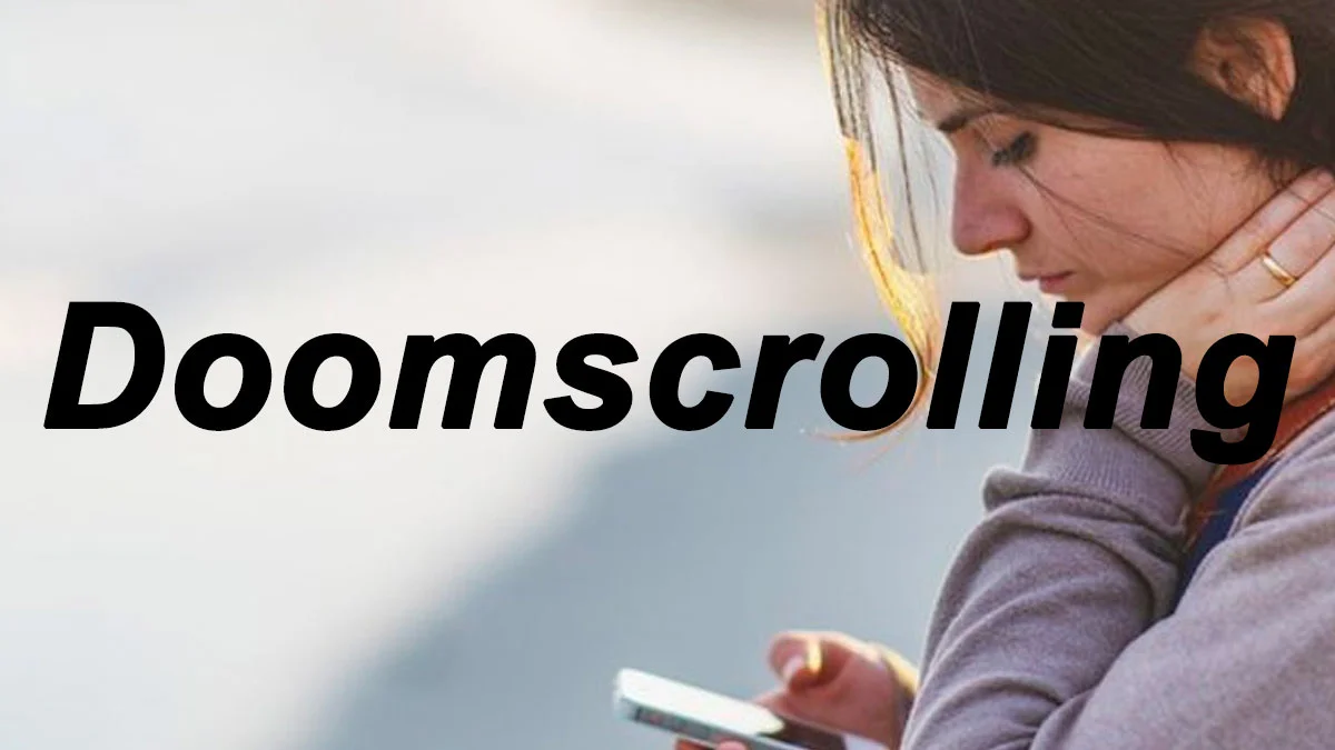 Illustration showing person in profile holding smartphone and looking down intently at screen labeled 'Doomscrolling.'