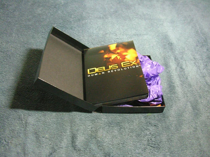 Dragon Dildos — Opened Deus Ex Human Revolution collector's box with purple tissue