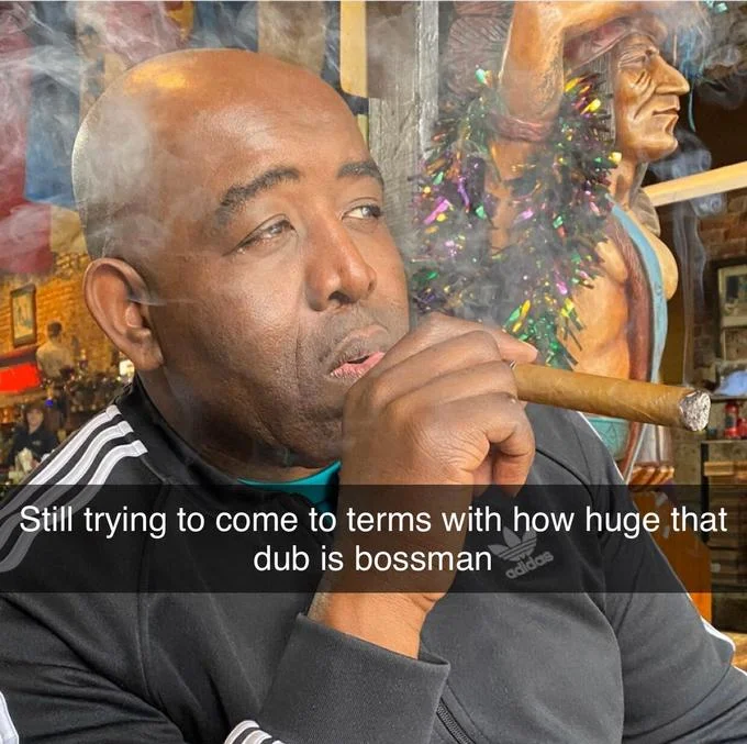 Robbie Lyle smoking cigar with caption about huge dub bossman