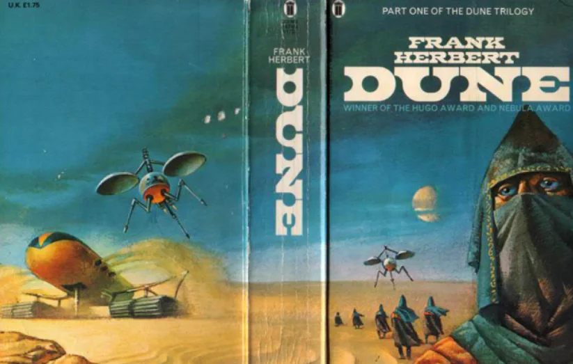 Frank Herbert's Dune book cover showing a hooded Fremen and an ornithopter over a desert landscape