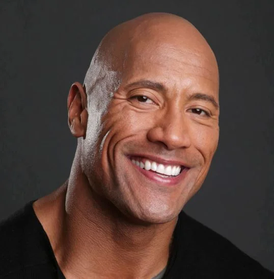 Dwayne The Rock Johnson — Close-up portrait of a smiling Dwayne 'The Rock' Johnson in a black shirt