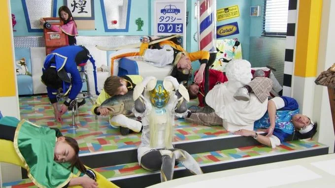 Eat Salmon On Christmas — Super Sentai costumed heroes and white monster character scattered on colorful set.