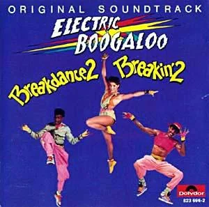 Electric Boogaloo — Official soundtrack cover from 1984 Breakin' 2 film with vibrant dancers and neon lettering.
