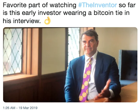 Elizabeth Holmes Theranos Fraud Case — Tweet screenshot about The Inventor documentary showing a Theranos investor wearing a Bitcoin tie