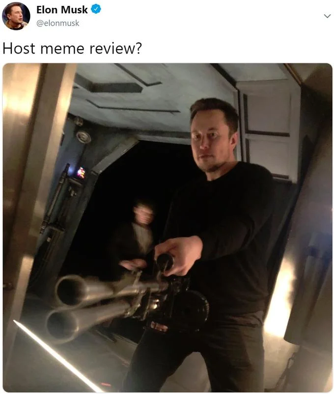 Elon Musk Holding A Minigun — Screenshot of Elon Musk tweet reading 'Host meme review?' with minigun photo attached
