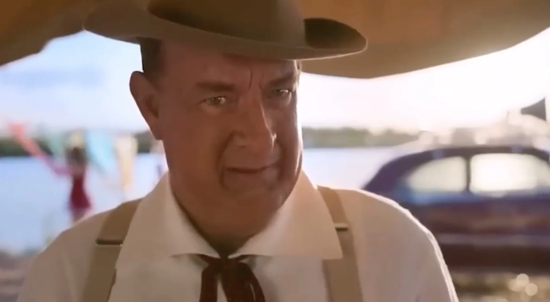 Elvis "He's White" Clip — Tom Hanks as Colonel Tom Parker in a cowboy hat reacting with surprise in a scene from the Elvis film