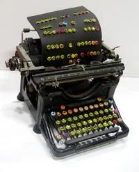 Emoticons — Vintage typewriter modified with colorful circular buttons replacing traditional keys.