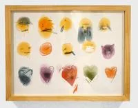 Emoticons — Wood-framed display with hand-painted yellow and orange emoticon-like faces and hearts.
