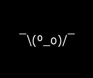 Emoticons — The shruggie kaomoji emoticon displayed in large white characters on black background.