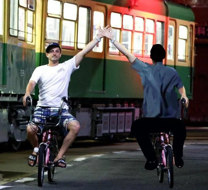 Enoden Bicycle Bro — Photoshop edit of bicycle bro high-fiving a mirrored cyclist beside Enoden train