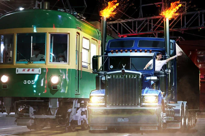 Enoden Bicycle Bro — Photoshop edit of bicycle bro waving from a flaming Kenworth truck beside Enoden train